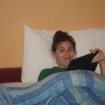Using my Tablet travel electronic in bed in Chiang Mai.