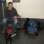 Tom guarding our bags while I go use the restroom.