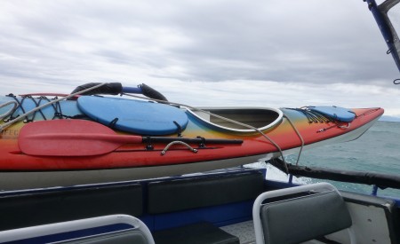 Kayak transporting on the back of the water taxi.