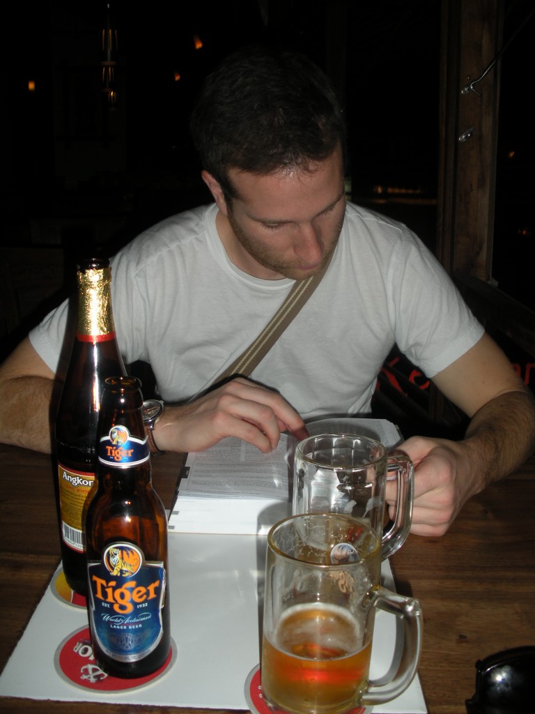 Tom Reading Guide Book The fiance Tom reading an "old-school" guide book. He needs a travel electronic: the Kindle