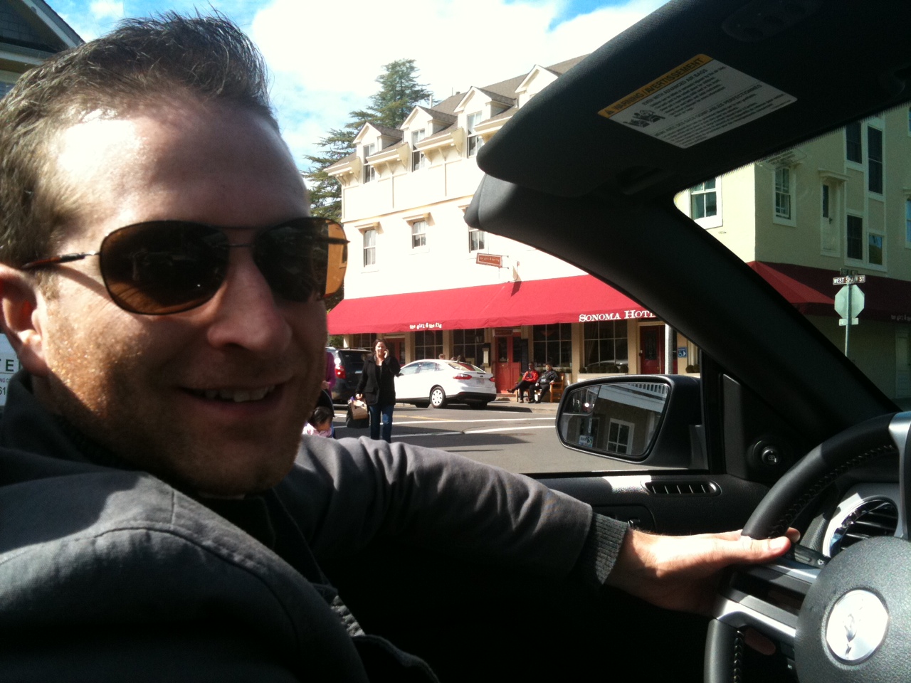 Tom driving in front of The Girl and the Fig Restaurant in Sonoma, California