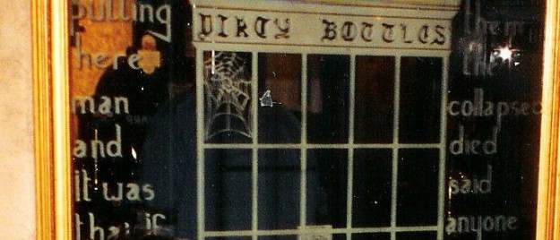 The view of the top of the window from inside Dirty Bottles which tells the tale of the fallen man, complete with a cobweb. Wait...I don't remember any cobwebs. It must be a ghost cobweb!