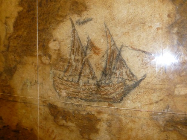 Off one of the Castillo San Cristobal tunnels was a galleon, where they kept prisoners. A former prisoner is said to have drawn ships on the wall of the galleon, such as this one.