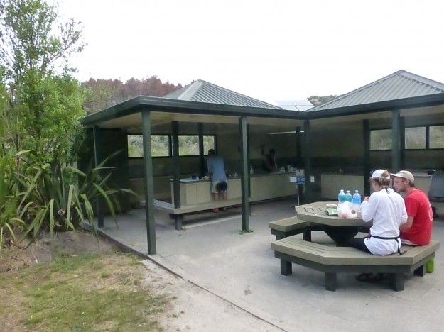 Camping in Abel Tasman: The Anchorage Bay kitchen station with fresh water, sinks, and counters for cooking.