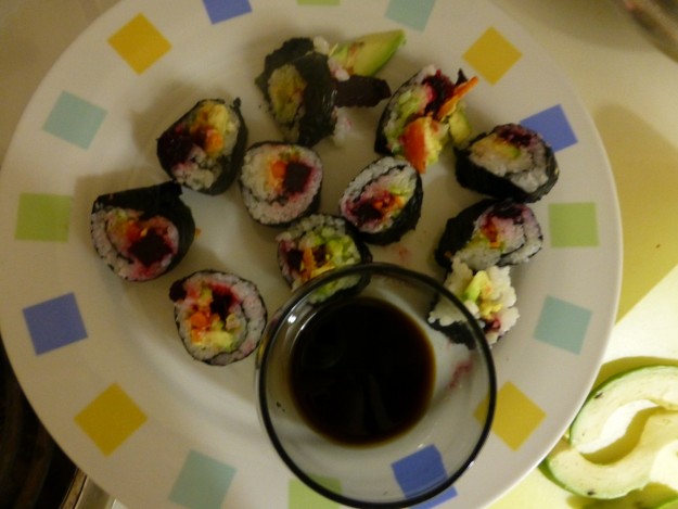 Making sushi at home: Beet, carrot, and avocado sushi roll - surprisingly AWESOME.