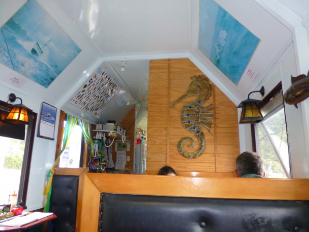 A couple of the fishing ship posters hung high on the walls of The Cray Pot Restaurant in New Zealand.