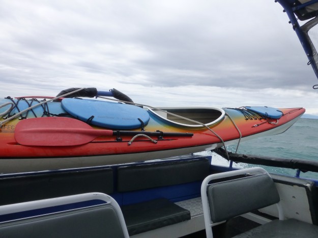 Kayak transporting on the back of the water taxi.