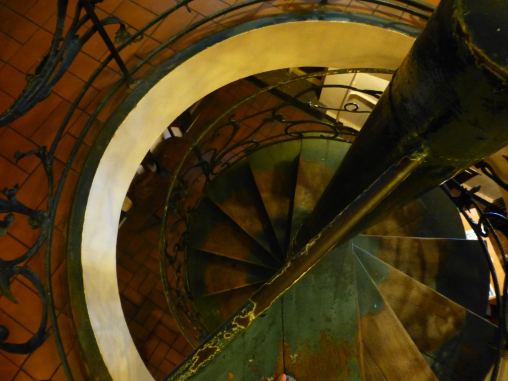 Looking down on the green spiral staircase at Zur Letzten Instanz Restaurant in Berlin. 