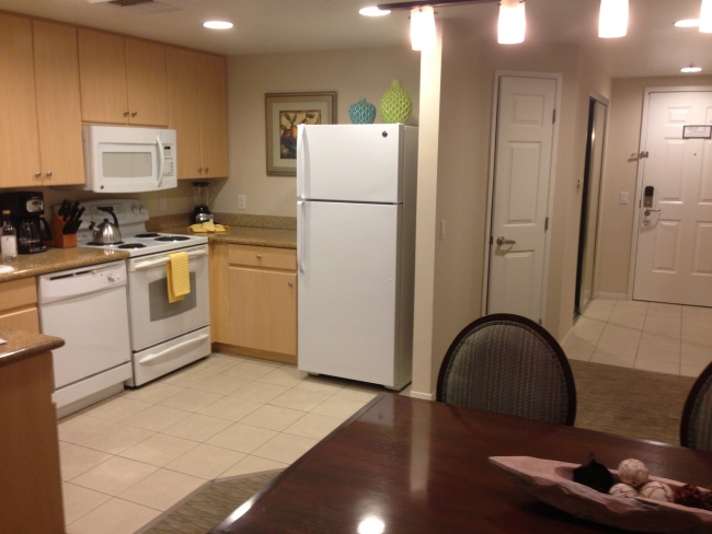 Large kitchen with dining area at Grand Pacific Palisades Resort in Carlsbad. 