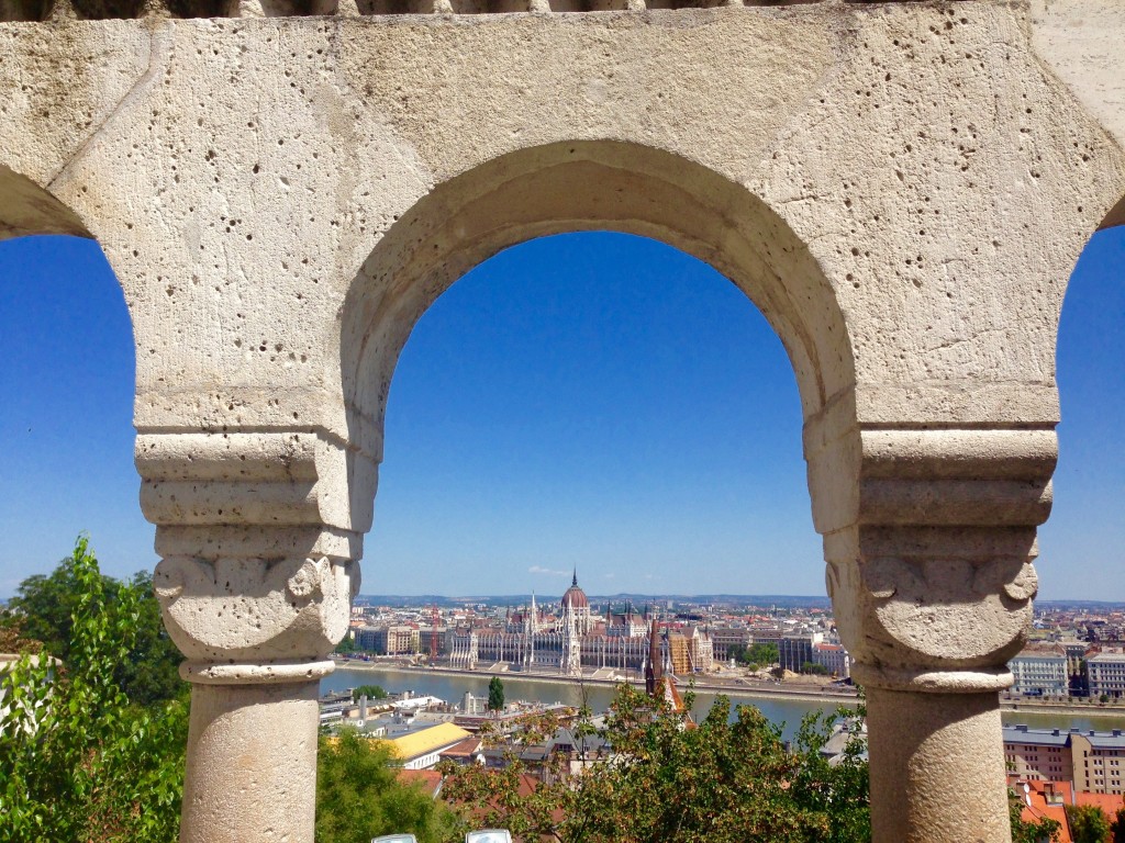 Take a day trip from Vienna to the gorgeous city of Budapest, Hungary, seen here from Fisherman's Bastion overlooking the Danube River and Parliament building. 