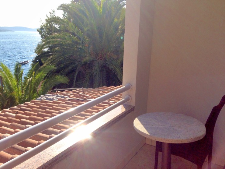 Sun dappled balcony overlooking the sea at Podstine Hotel in Hvar. 