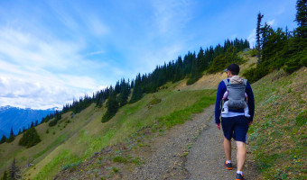 Hiking with a baby carrier.