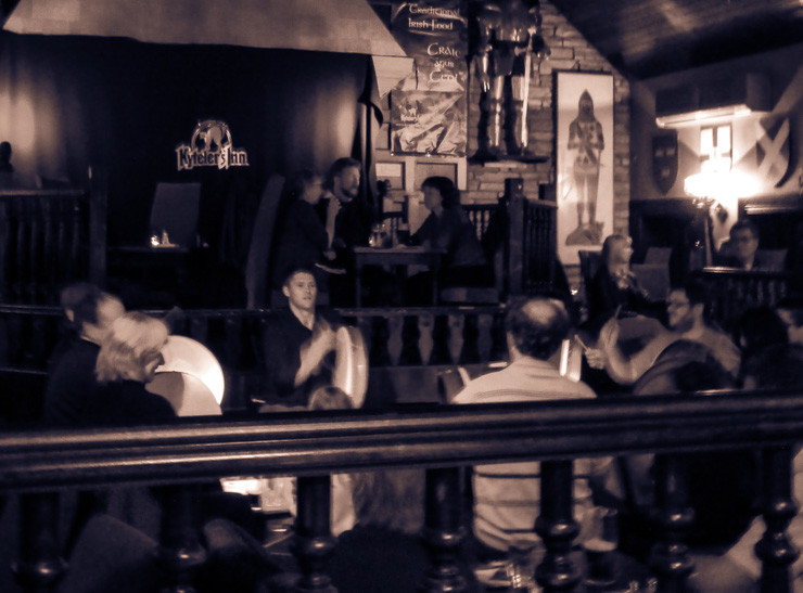 A fun, interactive musical performance using a traditional Celtic instrument in an Irish pub. 