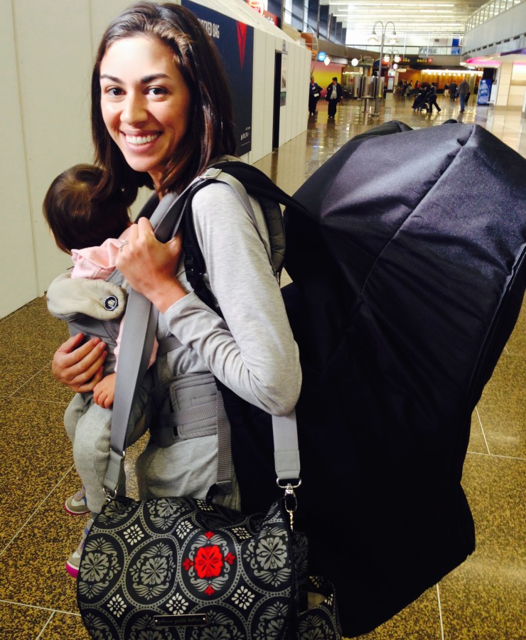 Suitcase checked and about ready to go through security on my most recent flight flying on my own with my baby. That smile is laced with trepidation.