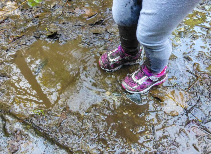 Muddy shoes on toddler hike.