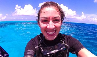 Me with a big smile after scuba diving in Bora Bora and seeing my first shark!