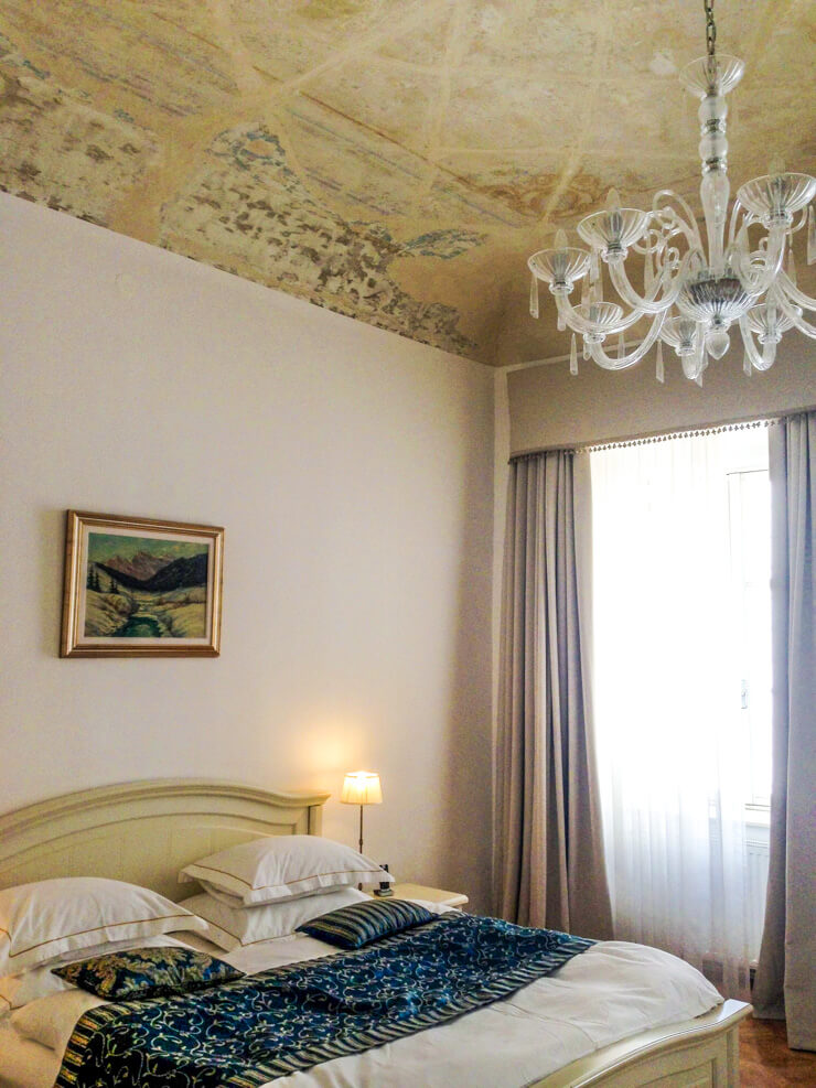 Antiq Palace bedroom in Ljubljana, Slovenia. That ceiling! That chandelier! Love it.