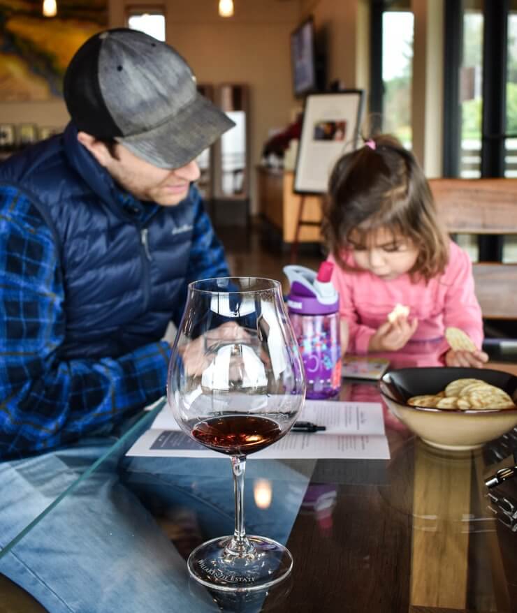 Toddler books and wine at a winery in Oregon's Willamette Valley. 