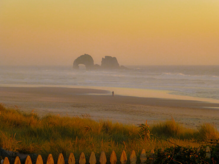 Walking along the wide beach with its large rock structures is one of the top things to do in Rockaway Beach, Oregon 