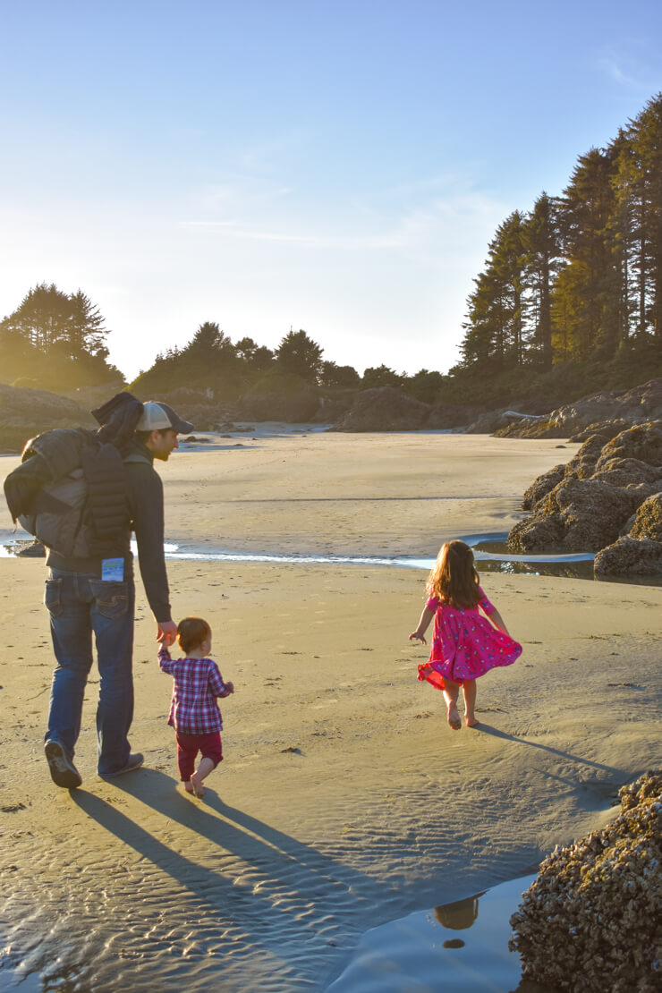 Walking along Cox Bay Beach at dusk. 