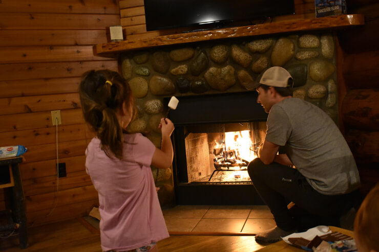 Roasting marshmallow in our adorable cabin at Tigh-na-mara Resort