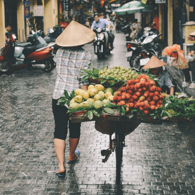 Pedestrian walking down a street in Hanoi. 