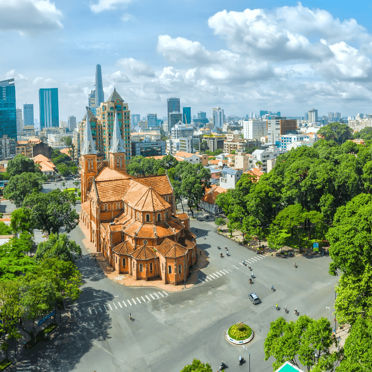 Ho Chi Minh City's Notre Dame Cathedral framed by the city skyline.