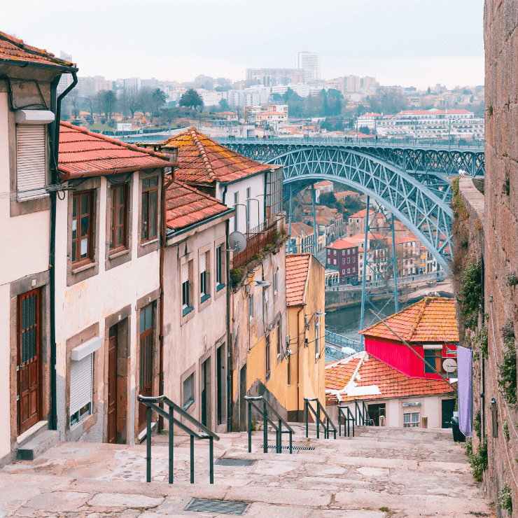 Pretty cobblestoned street in the Ribeira District of Porto overlooking the water. 