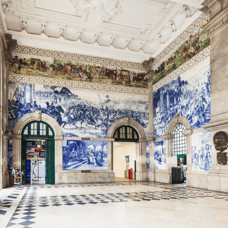 São Bento Train Station in Porto, Portugal, has beautiful walls covered in tiled art. 