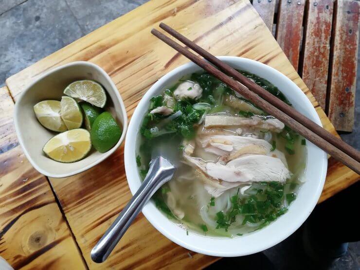 Chicken Pho with herbs and lime slices in Hanoi, Vietnam.