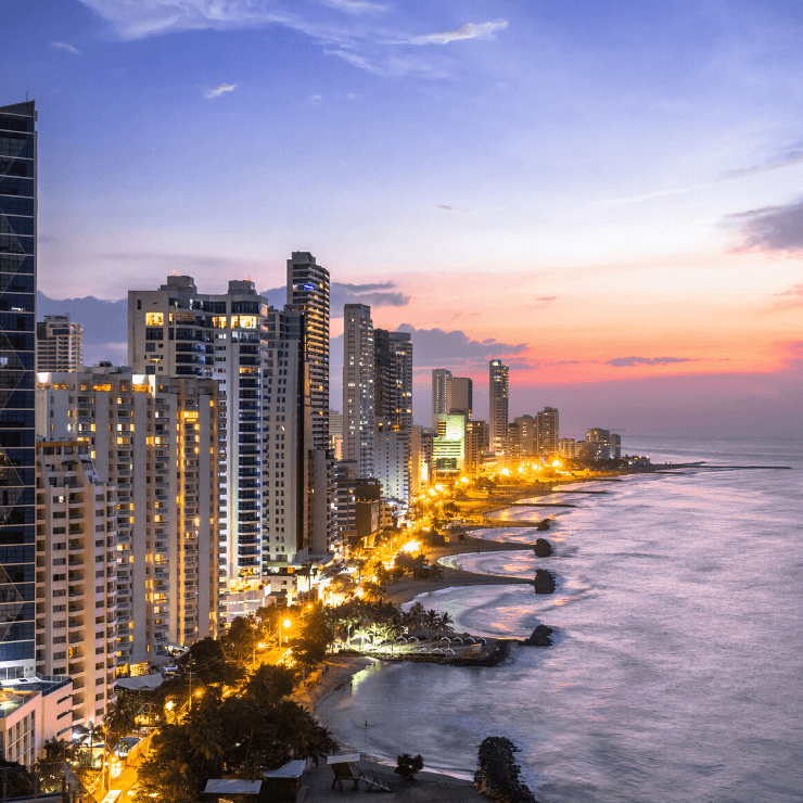 Sunset behind the skyscrapers of Cartagena, Colombia with an ocean view.