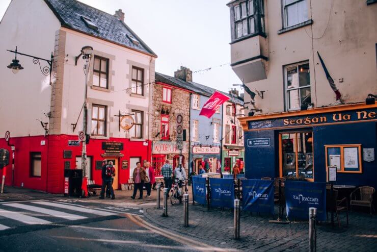 Pedestrians shopping along Quay Street in Galway, Ireland. 