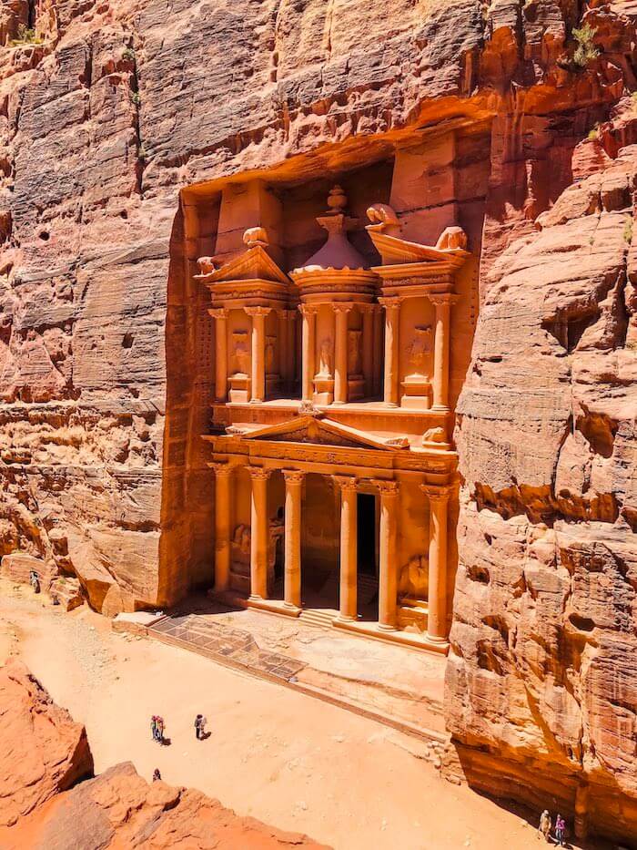 The treasury in Petra seen from an elevated viewpoint.
