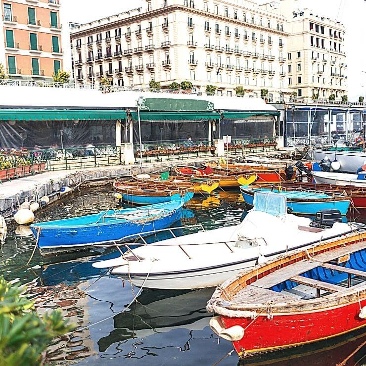 The pretty harbor of Borgo Marinari is great for boat and people watching