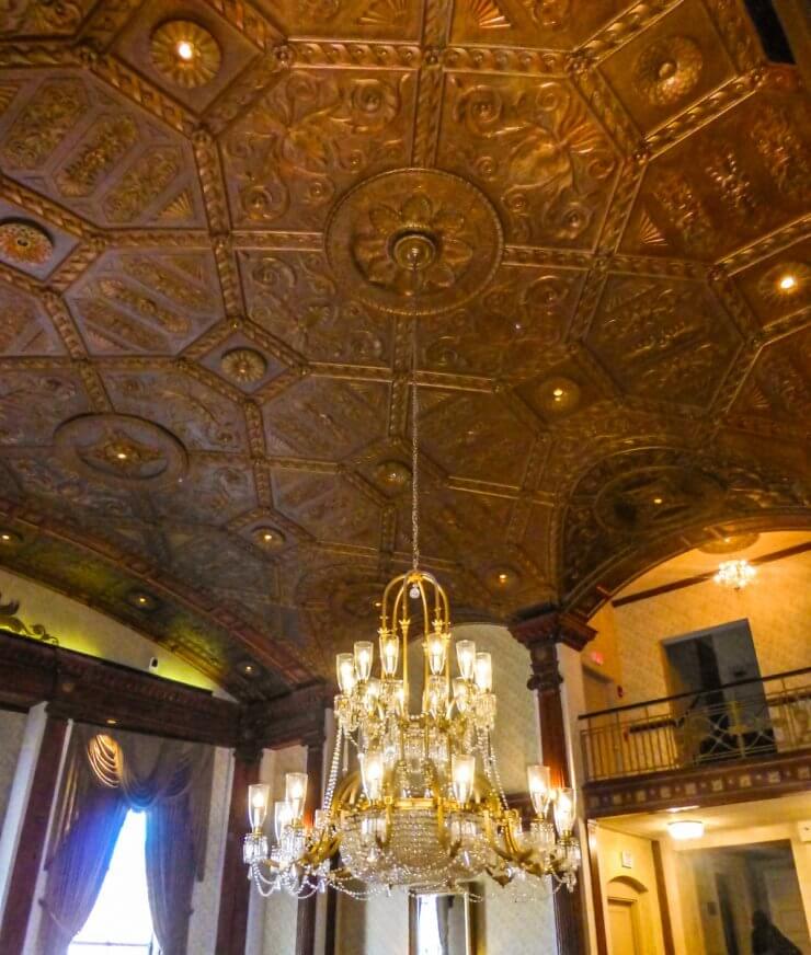 Beautiful, historic ceiling and chandelier in Providence's the Biltmore Hotel, a great place to stay during a Providence getaway.