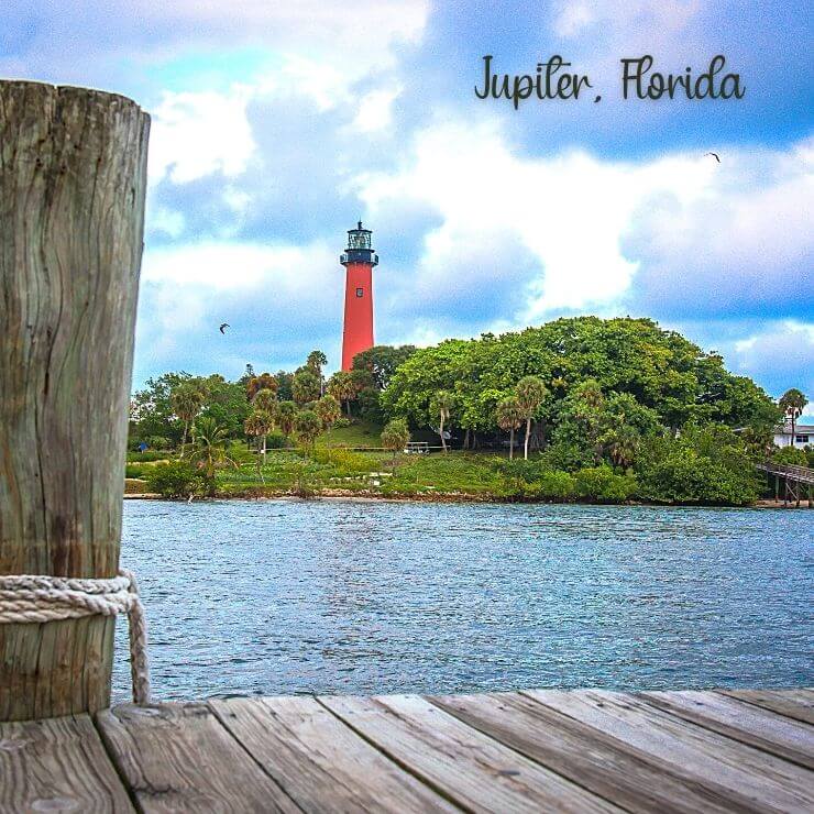 Jupiter Inlet Lighthouse seen from a dock on the water in Jupiter, Florida.