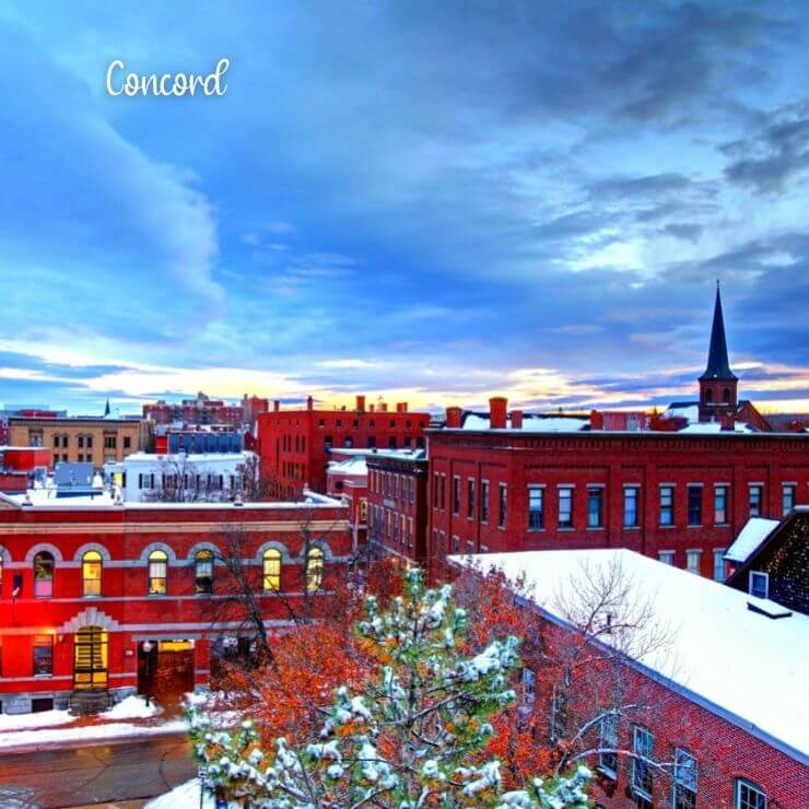 Snowcapped buildings during winter in New Hampshire.