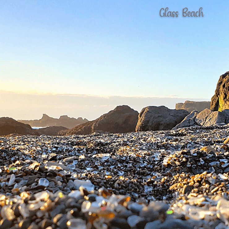 Sea glass mixed with sand at Glass Beach in California. 